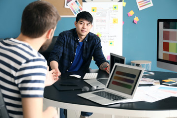 Young IT designers working in office