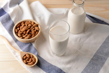 Composition with healthy almond milk on table