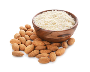 Bowl with almond flour on white background