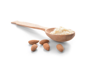 Spoon with almond flour on white background