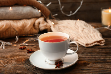 Cup of hot tea on wooden table
