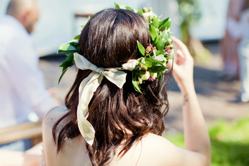 wreath with flowers and green leaves © aprilante