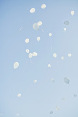white balloons in the sky