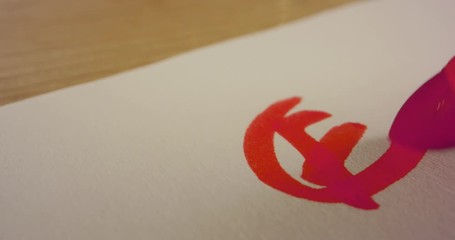 Macro shot of teacher marking a score on a school test