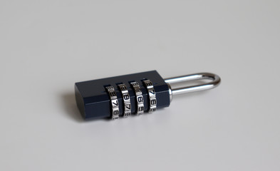 A locked combination lock on the white background.