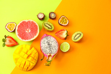 Assortment of exotic fruits on color background