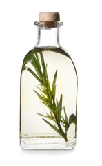 Bottle with rosemary oil on white background