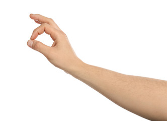 Male hand holding something on white background