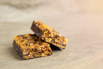 Muesli and cereal bar on marble stone background