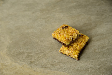 Muesli and cereal bar on marble stone background