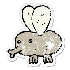 distressed sticker of a cartoon fly