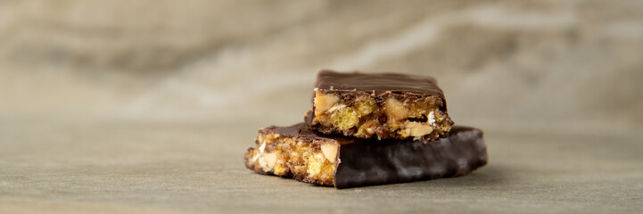 Muesli and cereal bar on marble stone background