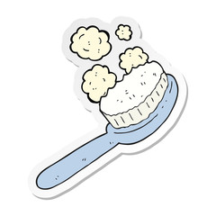 sticker of a cartoon brush