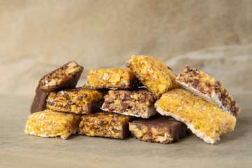 Various muesli bars on marble stone background