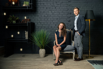 man sitting on sofa and looking at camera