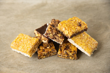 Various muesli bars on marble stone background