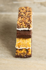 Various muesli bars on marble stone background