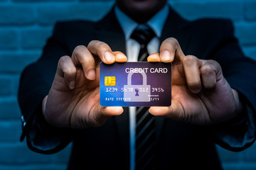 Business man holding credit card with technology icon.
