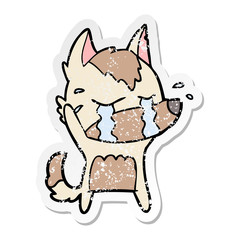 distressed sticker of a cartoon crying wolf