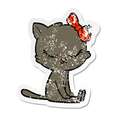 distressed sticker of a cute cartoon cat with bow