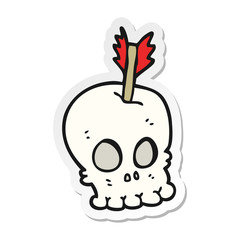 sticker of a cartoon skull with arrow