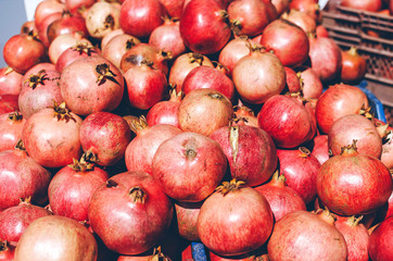 Pomegranate fruits and seeds kept for sale in the street of Turkey market.