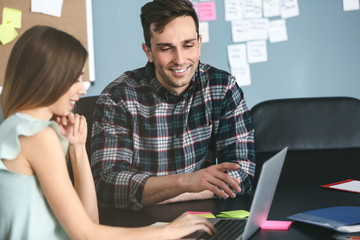 Young IT specialists working in modern office