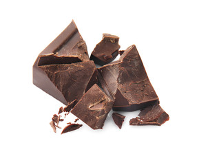 Pieces of tasty dark chocolate on white background