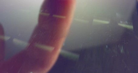 Macro shot of finger scrolling through social network on a smartphone