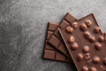 Tasty milk chocolate on grunge background