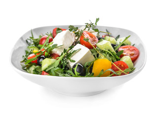 Bowl with healthy salad on white background