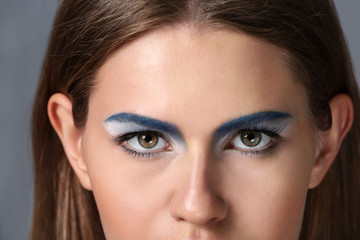 Beautiful young woman with bright makeup, closeup