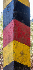 Historical black-red-golden border post at the former border between the German Democratic Republic (GDR) and the Federal Republic of Germany (FRG)