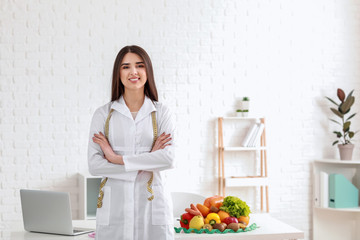 Portrait of female nutritionist in her office