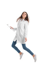 Happy female doctor jumping against white background