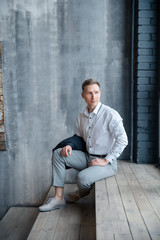 young man sitting on stairs