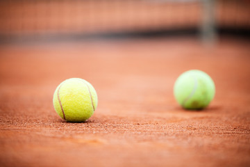 Close up of tennis ball on clay court./Tennis ball
