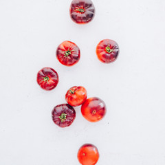 Tomatoes Mar Azul on white wooden table background