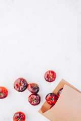 Tomatoes Mar Azul on white wooden table background