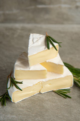 Cheese camembert or brie with fresh rosemary