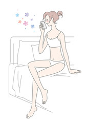 女性　スマホ　ベッド
