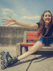 Joyful girl wearing roller skates