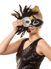 Mysterious woman wearing carnival mask