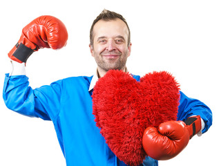 Man with boxing gloves holding heart