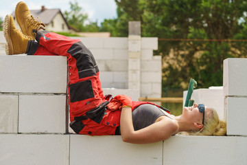 Woman taking break on construction site