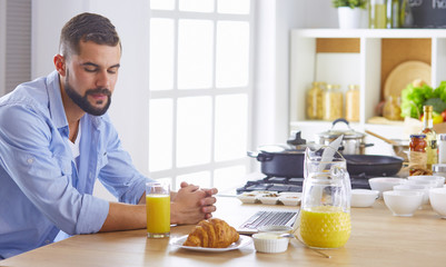 a business man breakfasts with notebook and juice