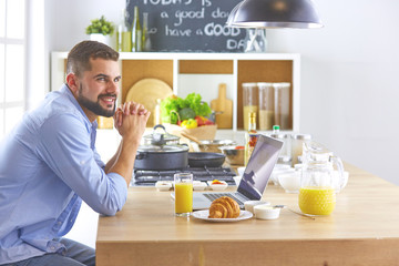 a business man breakfasts with notebook and juice