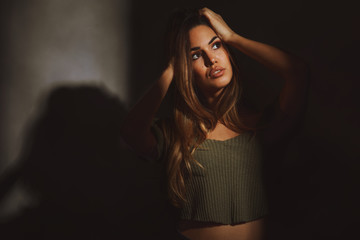 Portrait of a young woman in the room next to the window