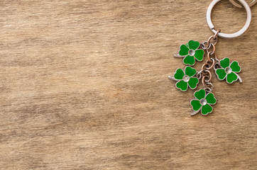 St Patrick's Day holiday background. Green quatrefoils on the wooden background, St Patrick's day festive holiday concept