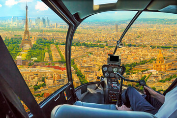 Helicopter cockpit flying on Panorama of Tour Eiffel and national residence of the Invalids in...